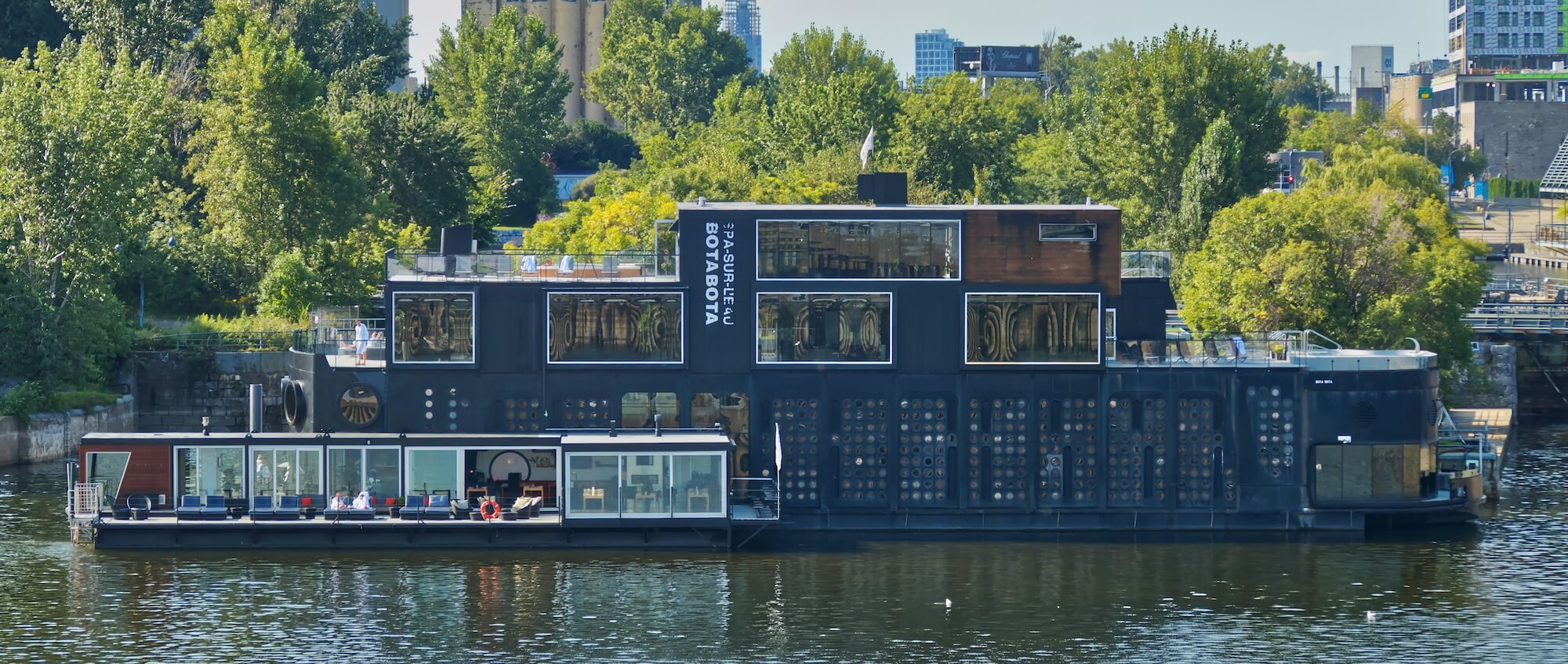 Bota Bota floating spa illuminated at dusk
